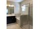 Elegant bathroom with double vanity, soaking tub, and walk-in shower at 8502 Arcadia Ln, Davenport, FL 33896