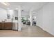 View into living room from kitchen area, with light floors and modern decor at 14501 Grove Resort Ave # 3137, Winter Garden, FL 34787