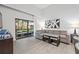 Living room with sectional sofa and sliding glass doors to a patio at 14501 Grove Resort Ave # 3137, Winter Garden, FL 34787