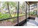 Screened patio with view of lush landscaping at 14501 Grove Resort Ave # 3137, Winter Garden, FL 34787