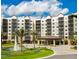 Multi-story building with a fountain and covered entrance at 14501 Grove Resort Ave # 3137, Winter Garden, FL 34787