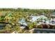 Large resort-style pool area with waterslides and lush landscaping at 14501 Grove Resort Ave # 3137, Winter Garden, FL 34787