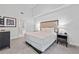 Main bedroom with king-size bed and ensuite bathroom access at 14501 Grove Resort Ave # 3137, Winter Garden, FL 34787