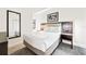 Second bedroom with a comfortable bed and a mirror at 14501 Grove Resort Ave # 3137, Winter Garden, FL 34787