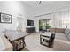 Spacious living room with comfortable seating and access to a balcony at 14501 Grove Resort Ave # 3137, Winter Garden, FL 34787