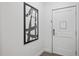 Apartment entryway with a framed print and white door at 14501 Grove Resort Ave # 3137, Winter Garden, FL 34787
