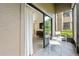Private screened-in patio with seating area at 14501 Grove Resort Ave # 3137, Winter Garden, FL 34787