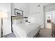 Bright bedroom with a comfortable queen-size bed and ample closet space at 14501 Grove Resort Ave # 3137, Winter Garden, FL 34787