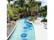 Relaxing lazy river with inner tubes for guests at 14501 Grove Resort Ave # 3137, Winter Garden, FL 34787