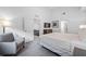 Spacious bedroom with a king-size bed and sitting area at 14501 Grove Resort Ave # 3137, Winter Garden, FL 34787