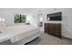King bedroom with TV and dresser at 14501 Grove Resort Ave # 3137, Winter Garden, FL 34787