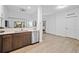 Open-concept kitchen and living area, bright and airy, modern finishes at 14501 Grove Resort Ave # 3329, Winter Garden, FL 34787