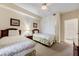 Guest bedroom with two twin beds and an ensuite bathroom at 13427 Blue Heron Beach Dr # 1004, Orlando, FL 32821