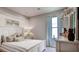 Bedroom with white shutter bed, light gray walls, and plenty of light at 12853 Charmed Dr, Winter Garden, FL 34787