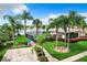 Community pool and cabana with lush landscaping and lake view at 2431 Pewter Ct, Orlando, FL 32837