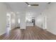 Open living room with new flooring, high ceilings, and kitchen access at 137 Birmingham Dr, Kissimmee, FL 34758
