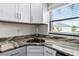 Modern kitchen with granite countertops and stainless steel sink at 137 Birmingham Dr, Kissimmee, FL 34758