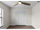 Well-lit bedroom with wood-look floors and built-in closet at 137 Birmingham Dr, Kissimmee, FL 34758
