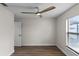 Light and airy bedroom, ceiling fan, and wood-look floors at 137 Birmingham Dr, Kissimmee, FL 34758