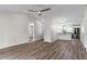 Open living room with new flooring, high ceilings, and kitchen access at 137 Birmingham Dr, Kissimmee, FL 34758
