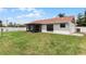 Large backyard with screened patio and grassy area at 137 Birmingham Dr, Kissimmee, FL 34758