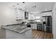 Modern kitchen with stainless steel appliances and granite countertops at 137 Birmingham Dr, Kissimmee, FL 34758