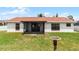 Charming backyard with screened lanai and bird bath at 137 Birmingham Dr, Kissimmee, FL 34758
