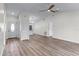 Open living room with new flooring, high ceilings, and kitchen access at 137 Birmingham Dr, Kissimmee, FL 34758