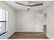 Spacious bedroom featuring wood-look floors and ceiling fan at 137 Birmingham Dr, Kissimmee, FL 34758