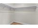 Spacious closet with wood-look floors and built-in shelving at 137 Birmingham Dr, Kissimmee, FL 34758