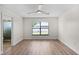 Bedroom with wood-look floors and a ceiling fan at 137 Birmingham Dr, Kissimmee, FL 34758