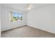 Spacious bedroom featuring a large window and ceiling fan at 11128 Cypress Leaf Dr, Orlando, FL 32825