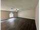Spacious living room with dark grey laminate flooring at 104 Richmar Ave, Haines City, FL 33844