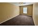 Simple bedroom with carpet flooring and window at 104 Richmar Ave, Haines City, FL 33844