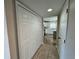 Hallway with tile floor, leading to kitchen and other rooms at 104 Richmar Ave, Haines City, FL 33844