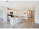 Modern kitchen with island, stainless steel appliances, and tile flooring at 1145 Brimstone Cir, Winter Haven, FL 33884