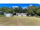 Single-wide mobile home with a large yard and detached shed at 22545 Orange Blossom Ln, Eustis, FL 32736