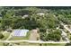 Wide aerial view showing home, large lot, and surrounding neighborhood at 22545 Orange Blossom Ln, Eustis, FL 32736