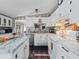 Spacious kitchen with white cabinets and a large island at 22545 Orange Blossom Ln, Eustis, FL 32736