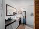 Clean bathroom with updated vanity and large mirror at 22545 Orange Blossom Ln, Eustis, FL 32736