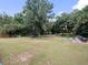 Spacious backyard with trampoline, playset, and ample green space at 22545 Orange Blossom Ln, Eustis, FL 32736
