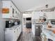 Modern kitchen with white cabinets, marble countertops, and stainless steel appliances at 22545 Orange Blossom Ln, Eustis, FL 32736