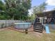 Inviting above-ground pool with wooden deck at 22545 Orange Blossom Ln, Eustis, FL 32736