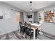 Farmhouse style dining area with wooden table and four chairs at 22545 Orange Blossom Ln, Eustis, FL 32736