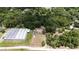 Aerial view of property and surrounding area with lush greenery at 22545 Orange Blossom Ln, Eustis, FL 32736