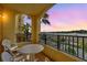 Private balcony with table and chairs, offering scenic views at 8112 Poinciana Blvd # 1305, Orlando, FL 32821