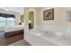 Relaxing bathroom with a large jacuzzi tub at 8112 Poinciana Blvd # 1305, Orlando, FL 32821