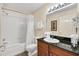 Clean bathroom with shower/tub combo and granite vanity at 8112 Poinciana Blvd # 1305, Orlando, FL 32821