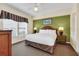 King-size bed, large windows, and soothing decor create a relaxing atmosphere at 8112 Poinciana Blvd # 1305, Orlando, FL 32821