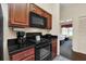 Well-equipped kitchen with microwave, stove, and coffee maker at 8112 Poinciana Blvd # 1305, Orlando, FL 32821